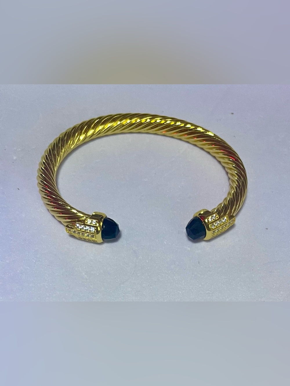 Gold-Tone Twisted Open Cuff Bracelet with Black Stone Ends